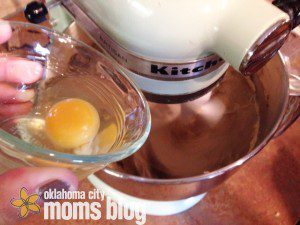 Add eggs one at a time so that they fully incorporate into the dough.