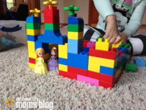Two little princesses fit perfect in this rainbow colored castle.