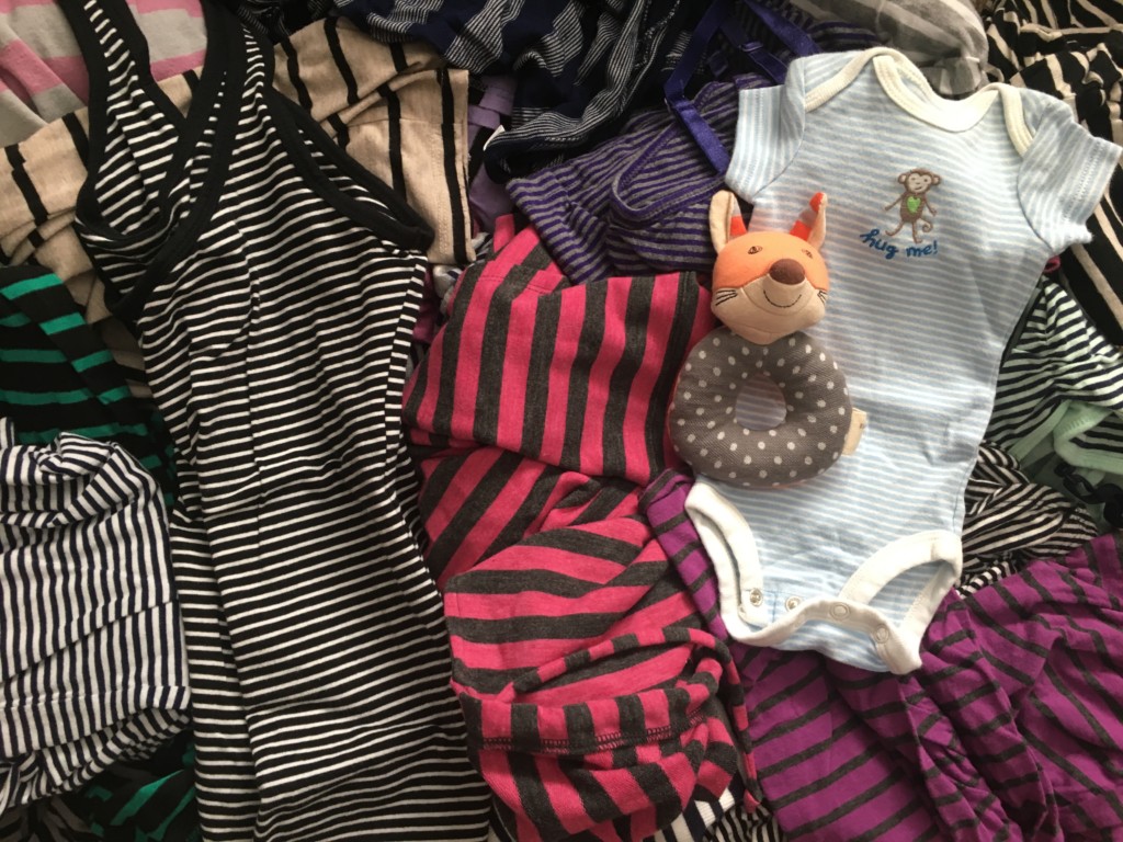 Pile of stripped maternity wear.